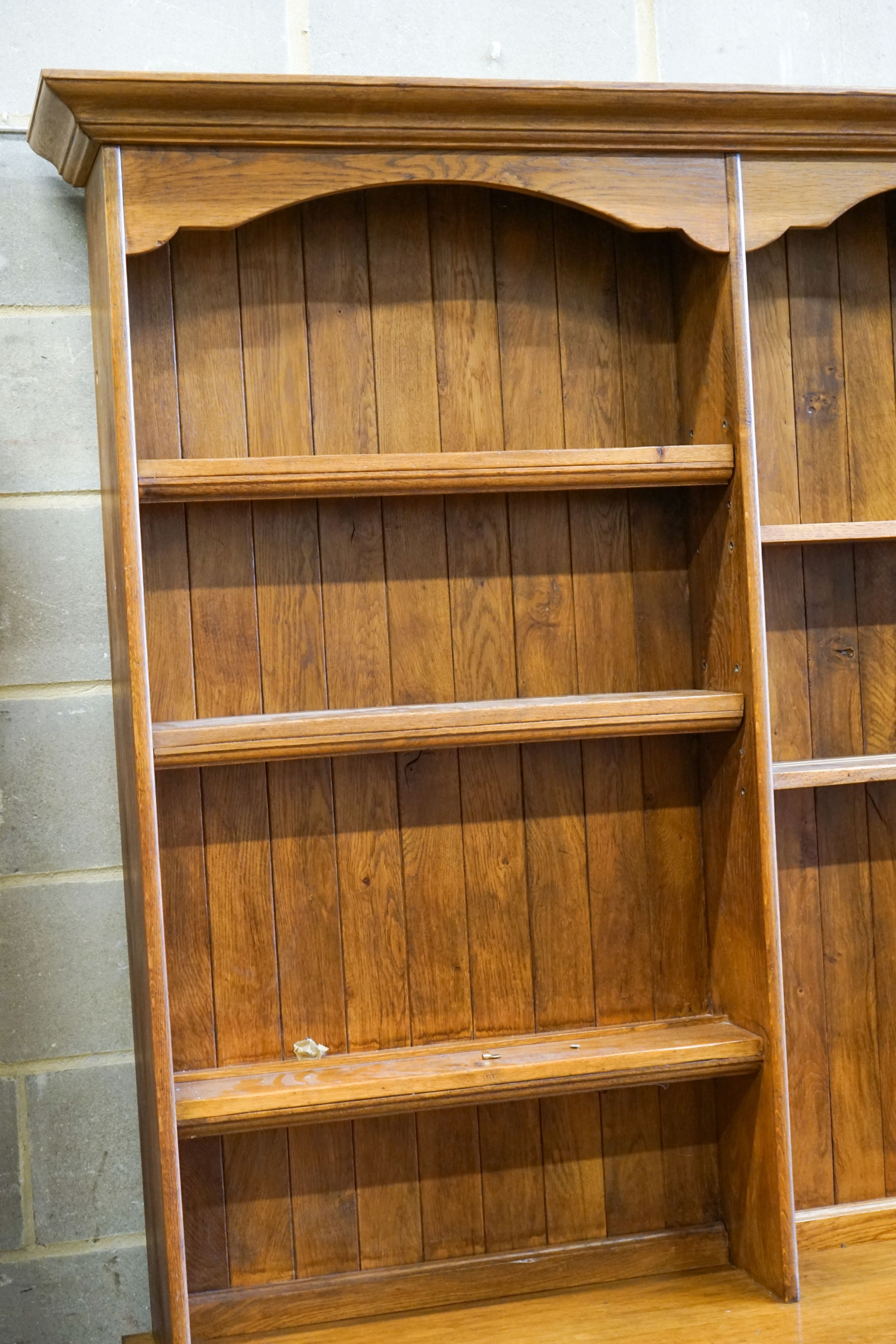 A large reproduction oak dresser, length 210cm, depth 48cm, height 225cm